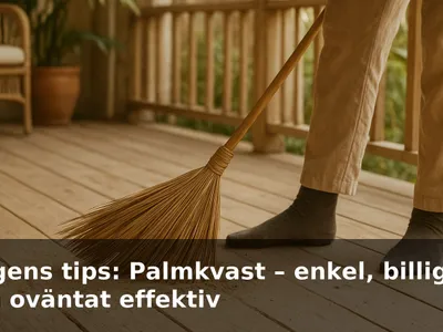 Handgjord palmkvast som sopar sand från en solig veranda