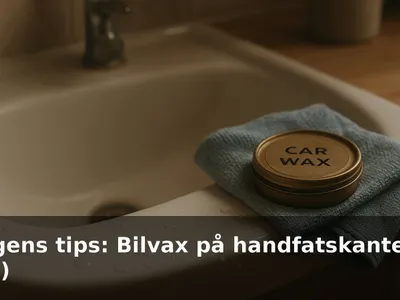 Vattenpärlor på en blank, vit handfatskant efter vaxning, en mikrofiberduk och en liten burk bilvax bredvid.