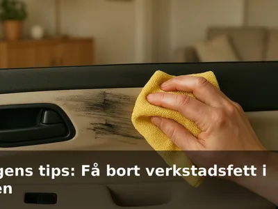 Hand som torkar bort svarta fettfläckar från en ljus bildörrspanel med en gul mikrofiberduk